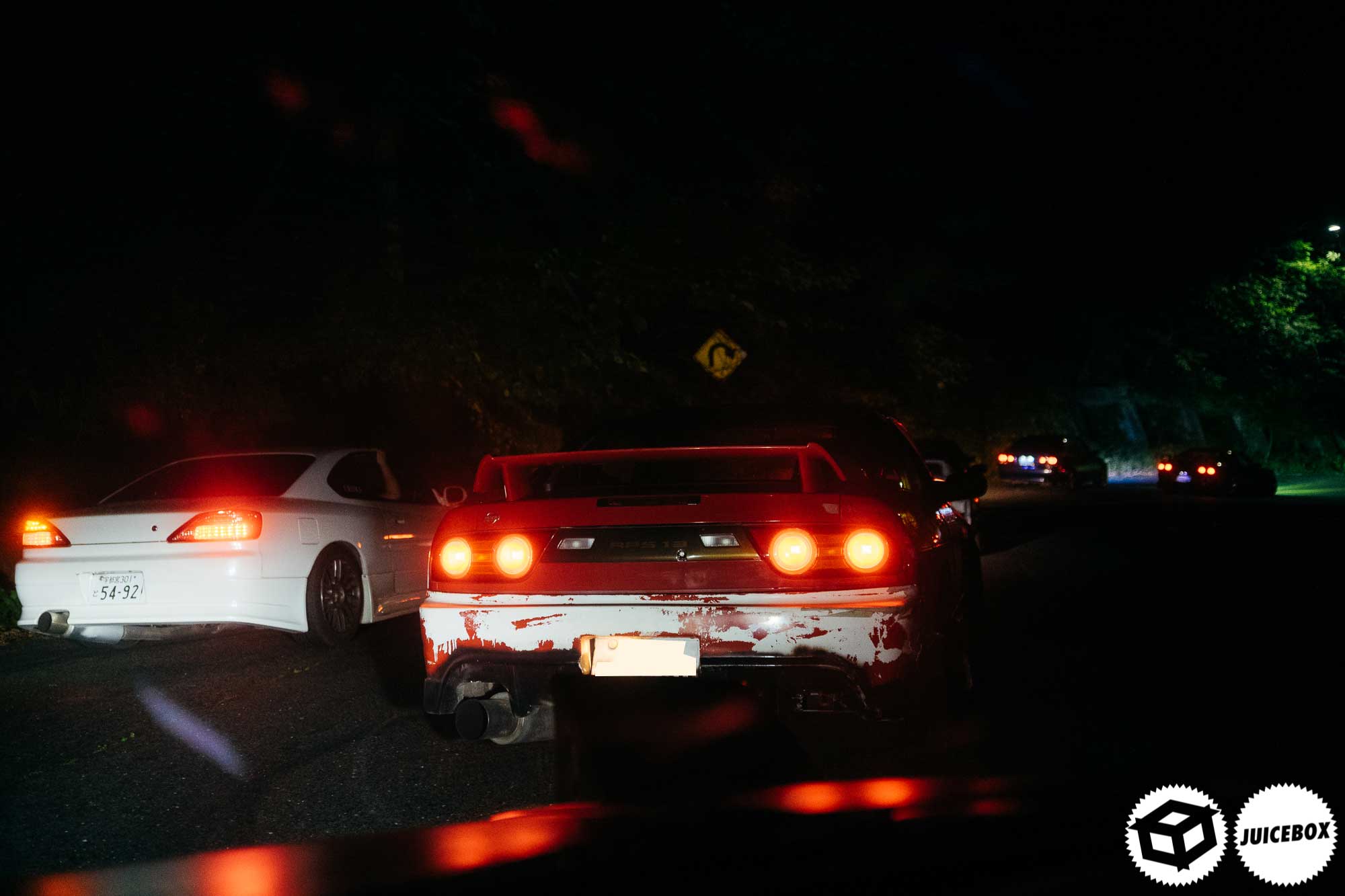 A jdm car drifting at night in the mountain